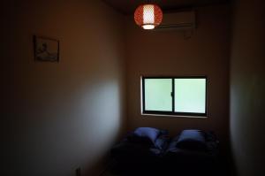 Postel nebo postele na pokoji v ubytování Chambre dhote Tatami