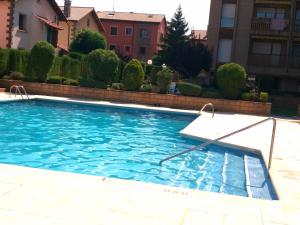 a swimming pool in the middle of a building at Jaca Rincón del Pirineo in Jaca