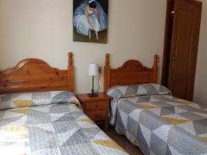 A bed or beds in a room at Casa El Reloj