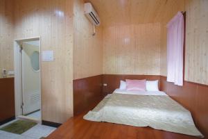 Voodi või voodid majutusasutuse Music House Homestay toas