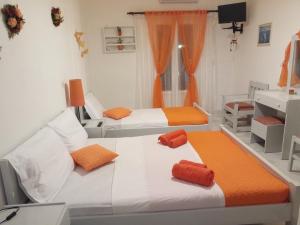 A bed or beds in a room at Drouga's Studios & Suites Astypalaia Greece