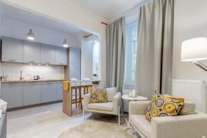 Posedenie v ubytovaní Riverside Deluxe Apartment