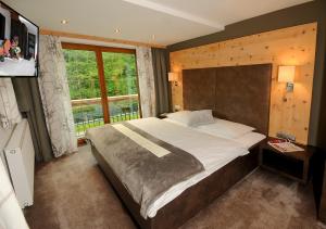 Rúm í herbergi á Hotel Burgschrofn