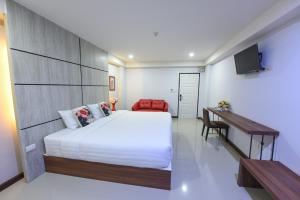 Postel nebo postele na pokoji v ubytování Wish Hotel Ubon