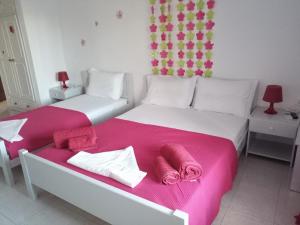 A bed or beds in a room at Drouga's Studios & Suites Astypalaia Greece
