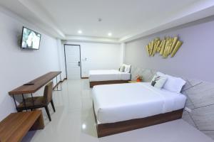 Postel nebo postele na pokoji v ubytování Wish Hotel Ubon + 16 fotografií