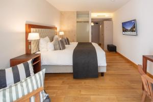 Letto o letti in una camera di Waldhotel Stuttgart