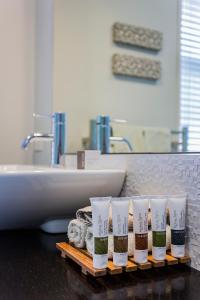 a group of four coffee cups sitting on a bathroom counter at Lakeview Tekapo in Lake Tekapo