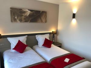Postel nebo postele na pokoji v ubytování Hôtel AKENA Besançon