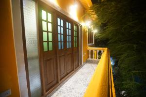 an entrance to a house with a wooden door at Mumbai Staytion Dorm- Hostel in Mumbai