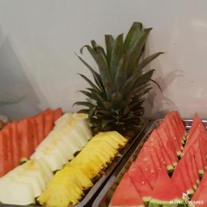 a plate of fruit with a pineapple on top of it at Ancares in Balboa