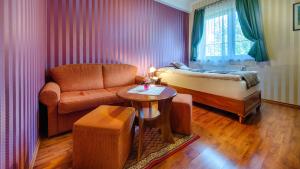 Postel nebo postele na pokoji v ubytování Hotel Tevel