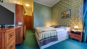Postel nebo postele na pokoji v ubytování Hotel Tevel