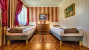 Postel nebo postele na pokoji v ubytování Hotel Tevel