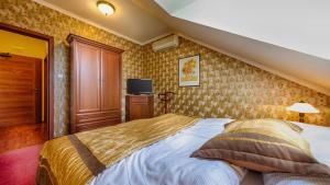 Postel nebo postele na pokoji v ubytování Hotel Tevel
