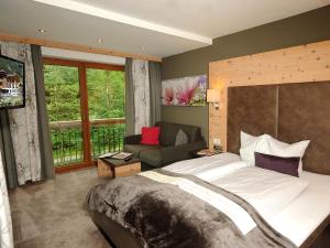 Rúm í herbergi á Hotel Burgschrofn