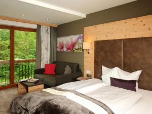 Rúm í herbergi á Hotel Burgschrofn
