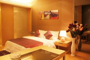 En eller flere senge i et værelse på Checkinn International Apartment (GuangZhou PaZhou Poly World Trade Branch)