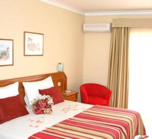 Ein Bett oder Betten in einem Zimmer der Unterkunft Hotel Peninsular