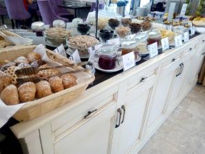 a buffet filled with lots of different types of food at Optima Collection Chernihiv in Chernihiv