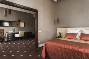 Postel nebo postele na pokoji v ubytování Ark Palace Hotel & SPA