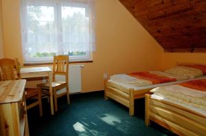 Ένα ή περισσότερα κρεβάτια σε δωμάτιο στο Pension Pod Hrádečkem
