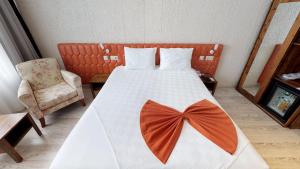 Postel nebo postele na pokoji v ubytování Patron Hotel