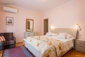 Postel nebo postele na pokoji v ubytování Rooms Vanda & Frane