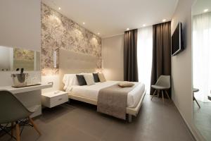 Postel nebo postele na pokoji v ubytování Hotel H21