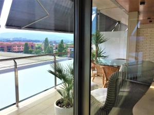 a living room with a view of a balcony at Apartment Ramon in Sant Antoni de Calonge