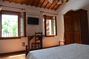 A bed or beds in a room at Colle Del Barbarossa