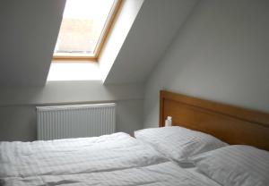 Postel nebo postele na pokoji v ubytování Apartmán Lednice