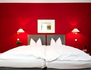 Postel nebo postele na pokoji v ubytování Hotel Albrechtshof Gohrisch