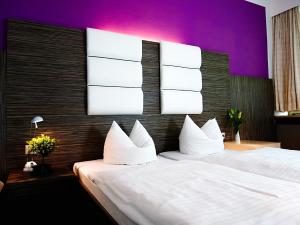 Postel nebo postele na pokoji v ubytování Hotel Albrechtshof Gohrisch