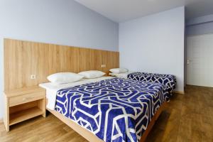 Cama o camas de una habitación en Guest House Arlen