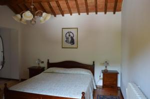 A bed or beds in a room at Colle Del Barbarossa