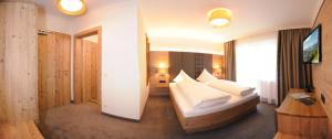 Una cama o camas en una habitación de Hotel Birkenhof