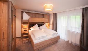 Una cama o camas en una habitación de Hotel Birkenhof