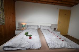 a bedroom with two beds with cherries on them at Wegscheiderhof in Mühltal