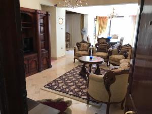 a living room with couches and a table at New Maadi Apartment in Cairo