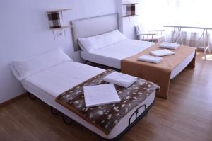 Posteľ alebo postele v izbe v ubytovaní ArArAt Hostel