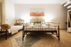 Postel nebo postele na pokoji v ubytování B&B Li Tarici