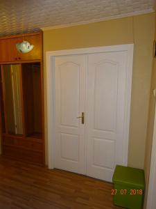 a room with a white door and a closet at Briedis un partneri in Cēsis
