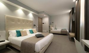 Postel nebo postele na pokoji v ubytování Hotel H21