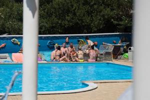 a group of people sitting in a swimming pool at Villa Ani in Novalja