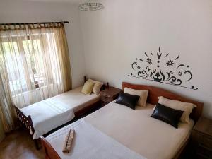 Postel nebo postele na pokoji v ubytování Apartments Vukotic