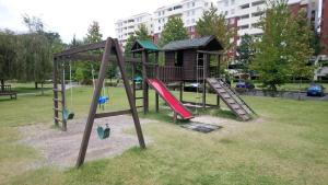 a playground in a park with a slide at Naths Apartment in Guatemala