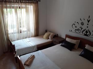 Postel nebo postele na pokoji v ubytování Apartments Vukotic
