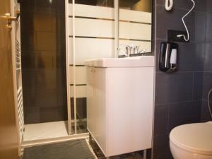 a bathroom with a sink and a shower at Jimena in Burgos +8 photos