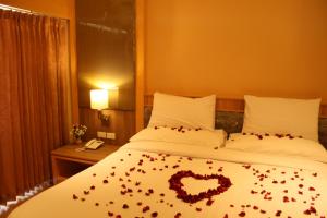 Ένα ή περισσότερα κρεβάτια σε δωμάτιο στο Kitlada Hotel Udonthani
